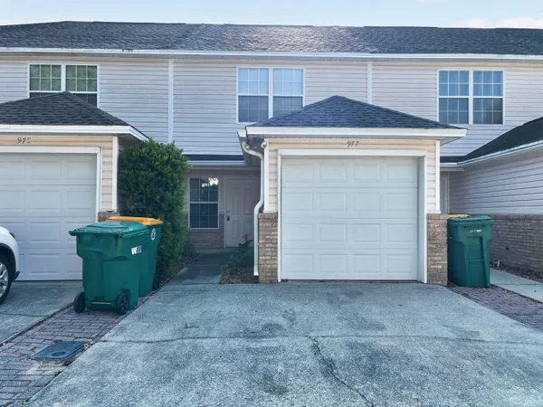 a front view of a house with garage
