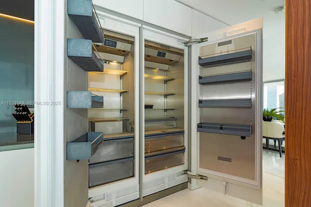 a bedroom with a bed and large window