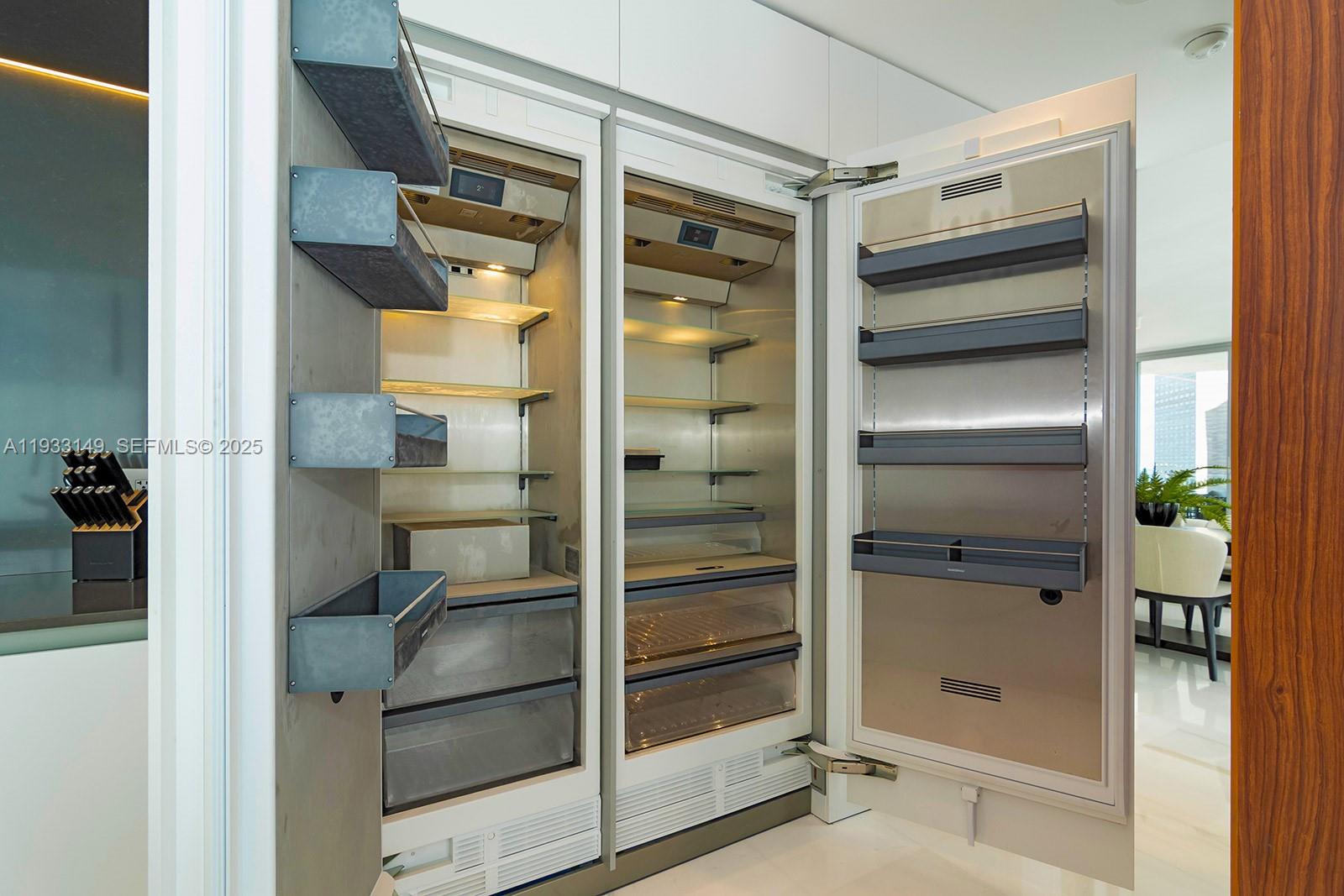 300 Biscayne Blvd Way, Unit 1901 Miami, FL 33131 - Photo 22 of 57 a refrigerator freezer sitting inside of a room