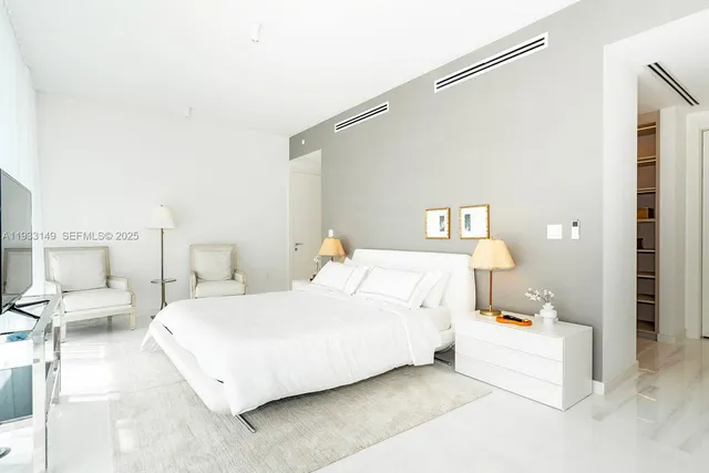a bathroom with a shower and a glass door
