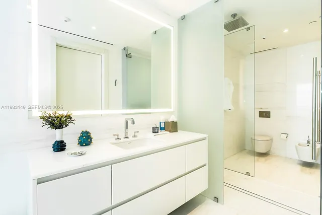 a living room with a large window and a glass door