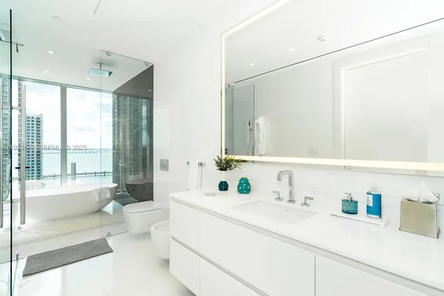 a bedroom with a bed and a night stand