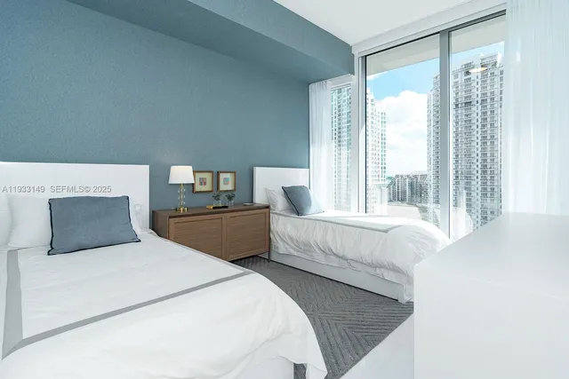 a living room with furniture and a lamp