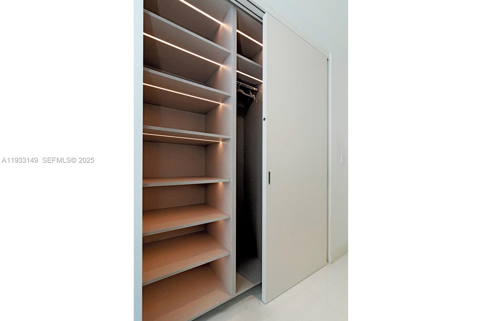 300 Biscayne Blvd Way, Unit 1901 Miami, FL 33131 - Photo 42 of 57 a view of walk in closet with empty racks