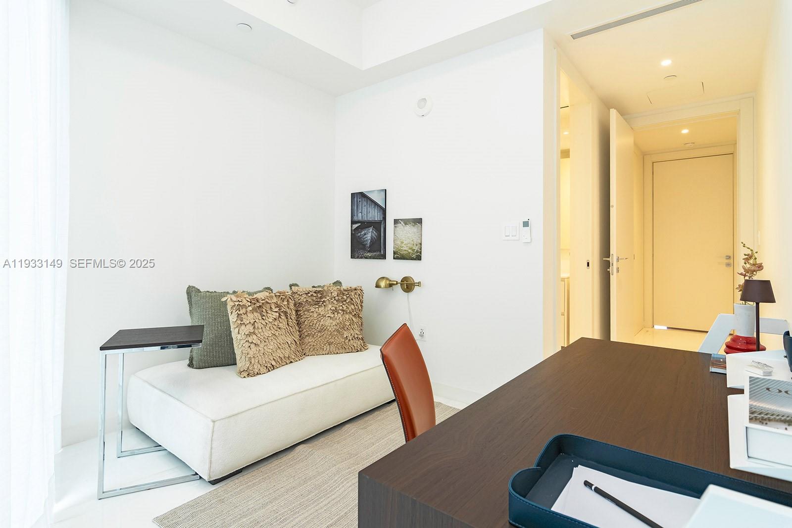 300 Biscayne Blvd Way, Unit 1901 Miami, FL 33131 - Photo 45 of 57 a living room with furniture and a potted plant