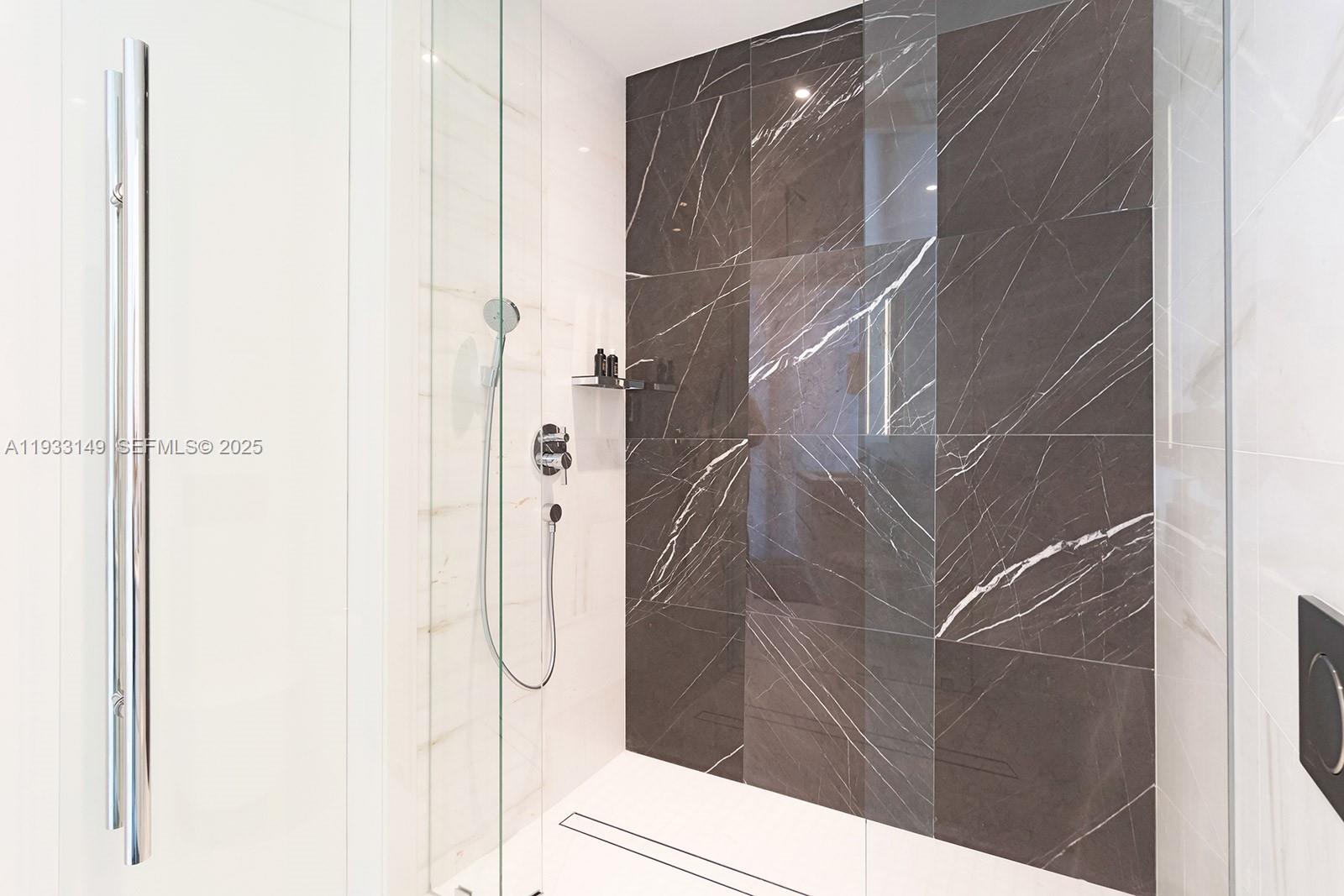 300 Biscayne Blvd Way, Unit 1901 Miami, FL 33131 - Photo 55 of 57 a bathroom with a glass shower door