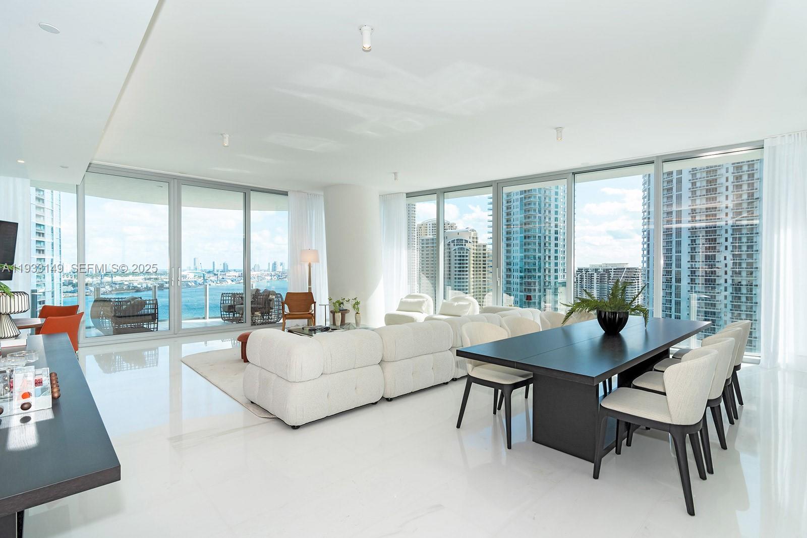 300 Biscayne Blvd Way, Unit 1901 Miami, FL 33131 - Photo 9 of 57 a living room with furniture and a large window