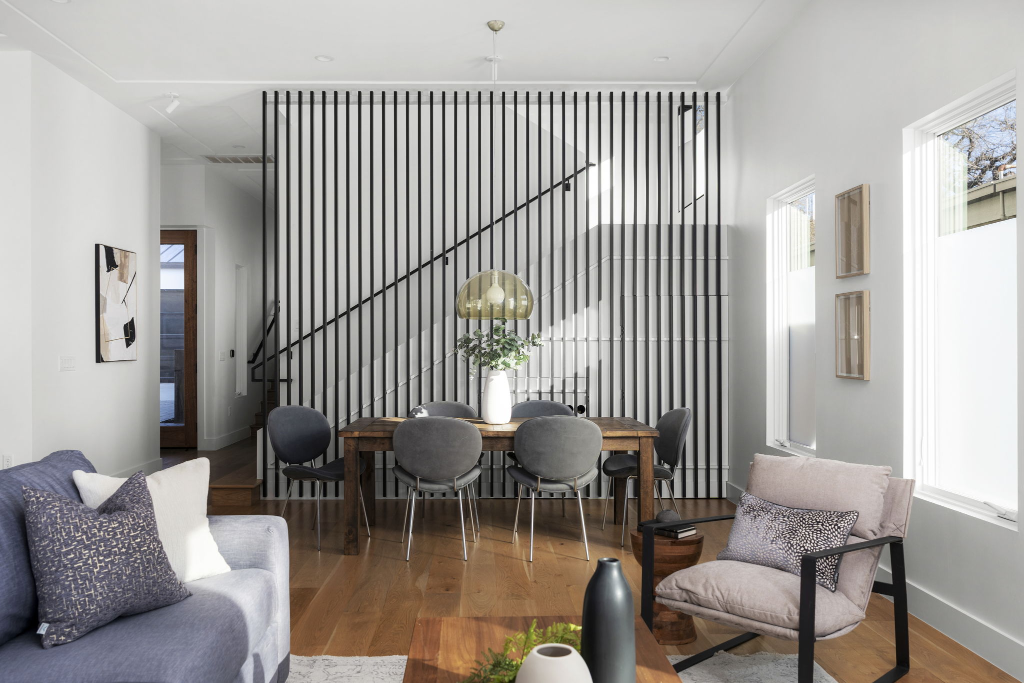 2001 Forest Trail Austin, TX 78703 - Photo 12 of 40 Living room with hardwood / wood-style flooring and hanging lights