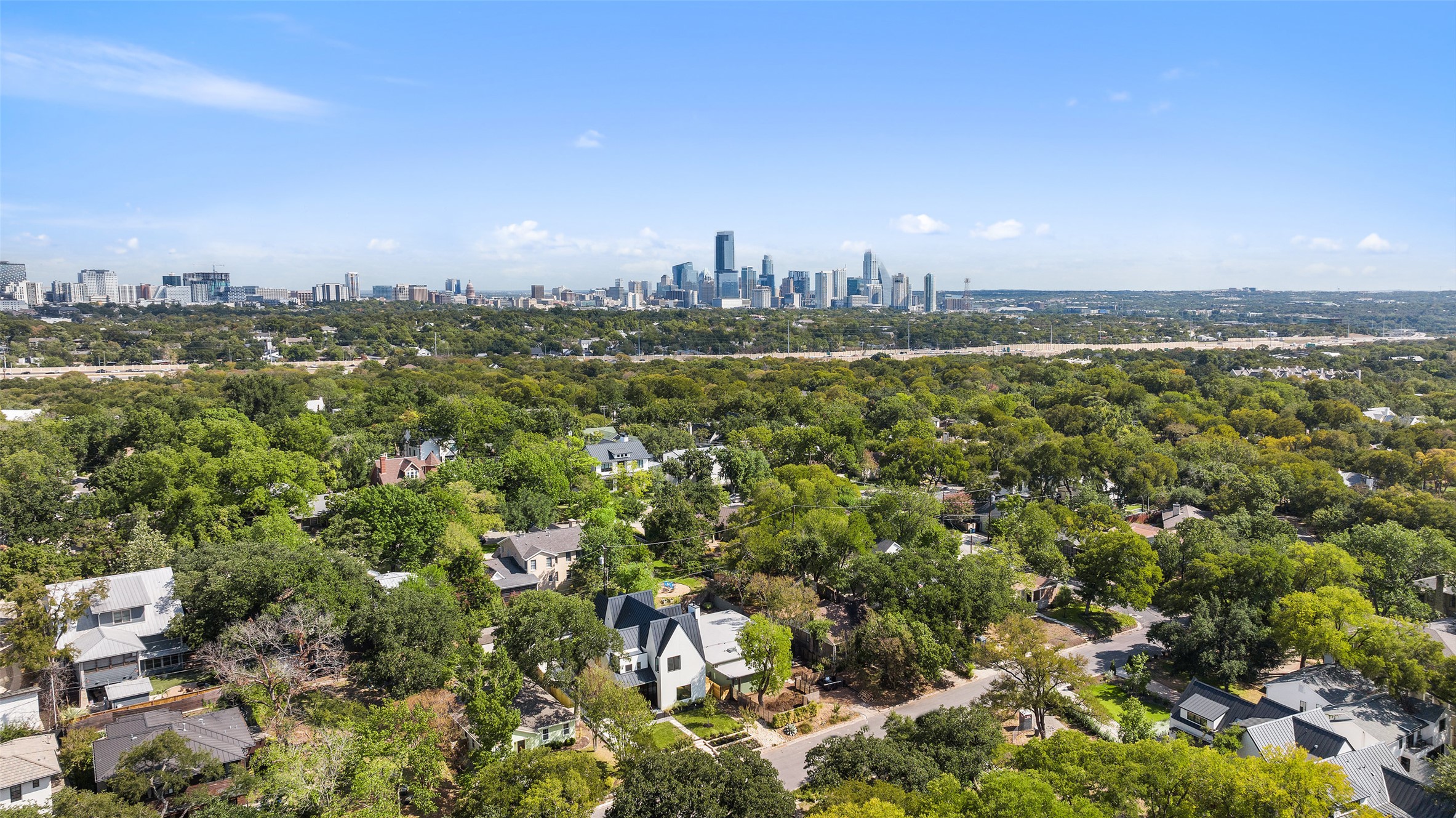 2001 Forest Trail Austin, TX 78703 - Photo 3 of 40 Aerial view of residential area featuring skyline and a tree filled landscape