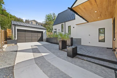 a front view of a house with garage