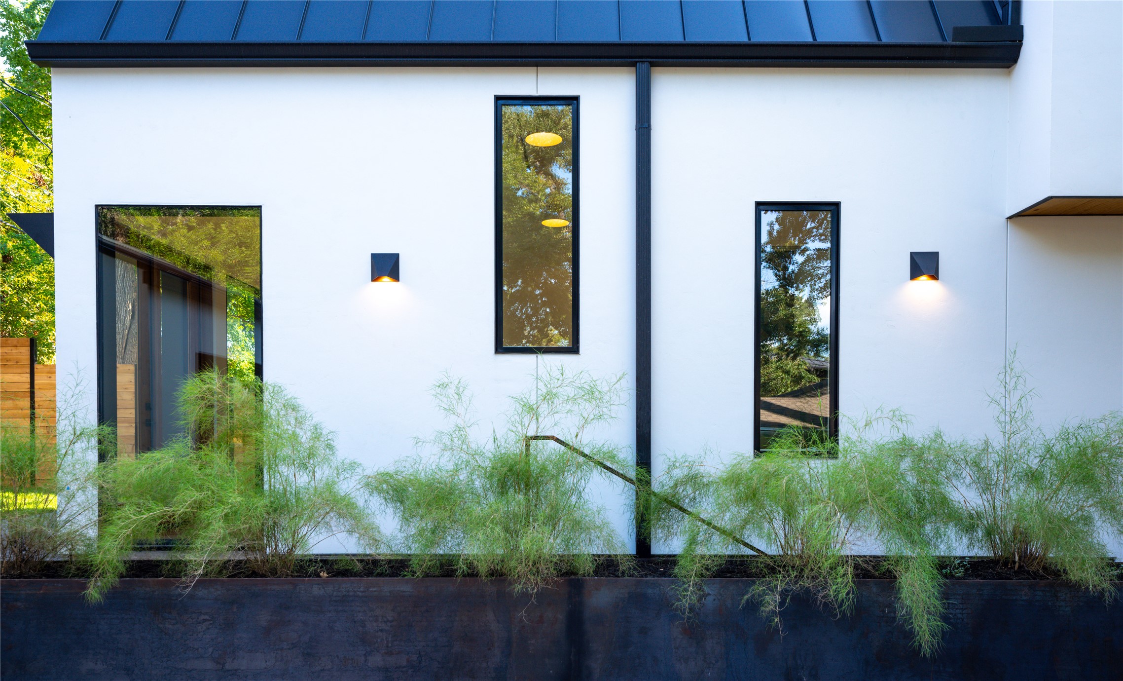2001 Forest Trail Austin, TX 78703 - Photo 37 of 40 View of property exterior featuring a standing seam roof and stucco siding