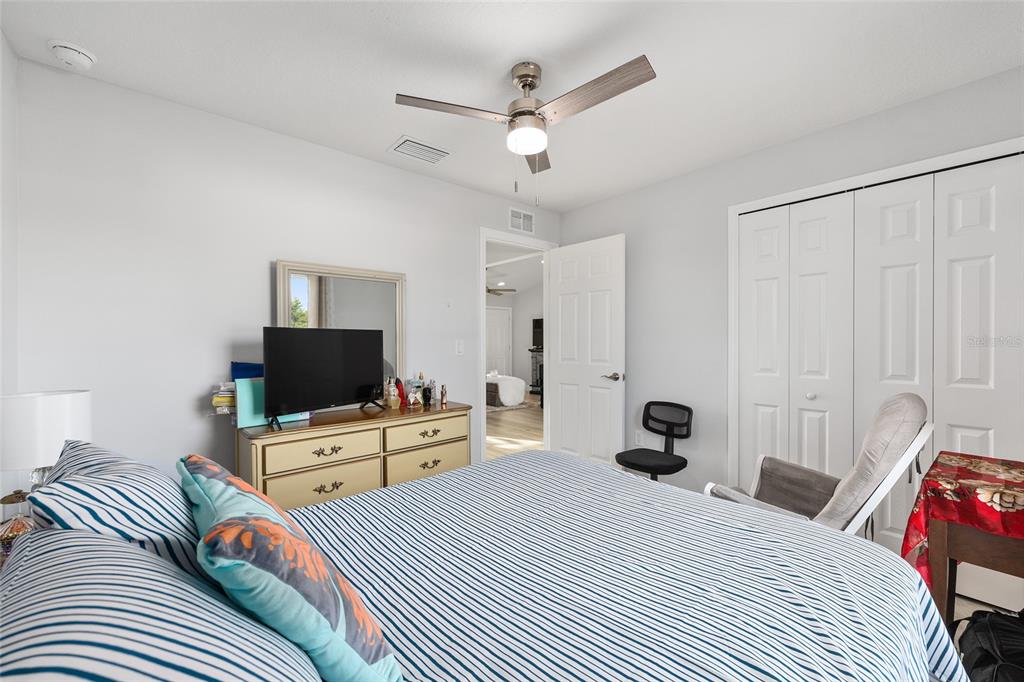 3597 Southwest 151st Avenue Ocala, FL 34481 - Photo 26 of 35 a bedroom with a bed and a flat screen tv