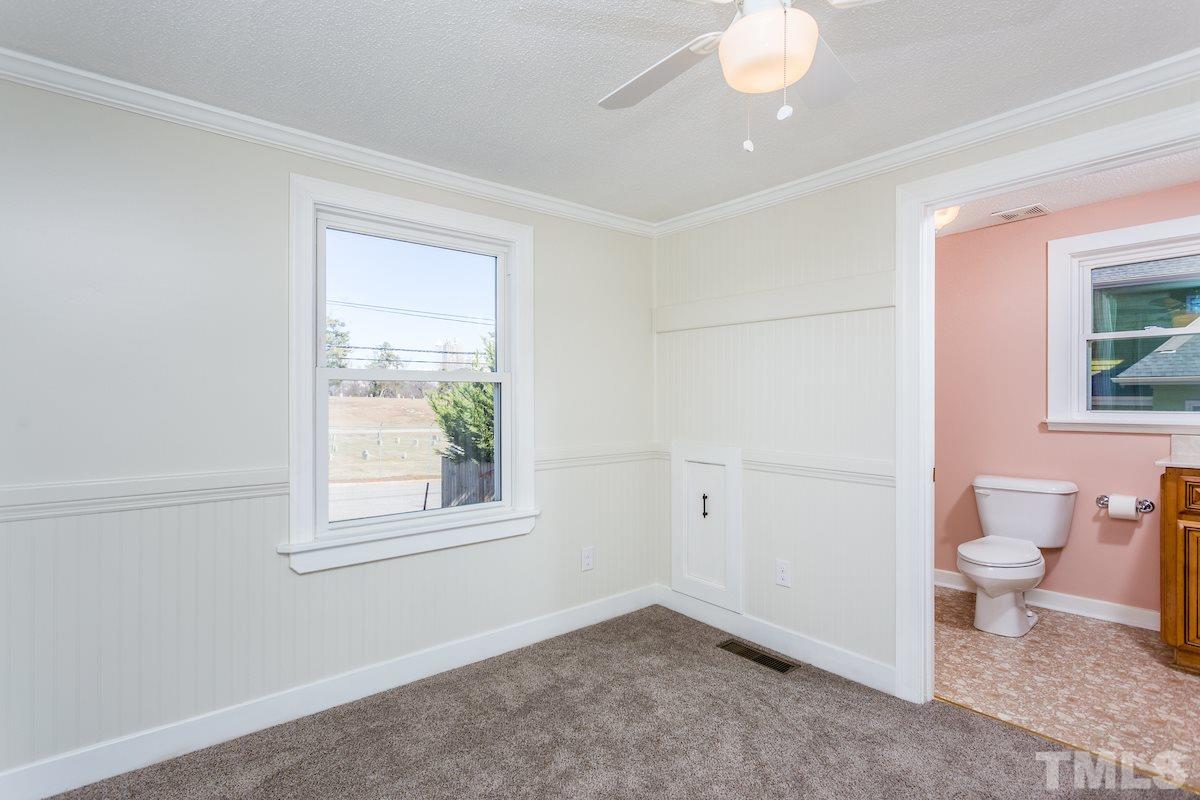 161 Prospect Avenue Raleigh, NC 27603 - Photo 14 of 24 a bathroom with a toilet sink and a window