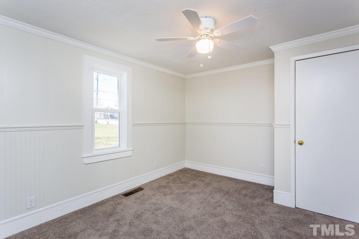 161 Prospect Avenue Raleigh, NC 27603 - Photo 16 of 24 an empty room with windows and fan