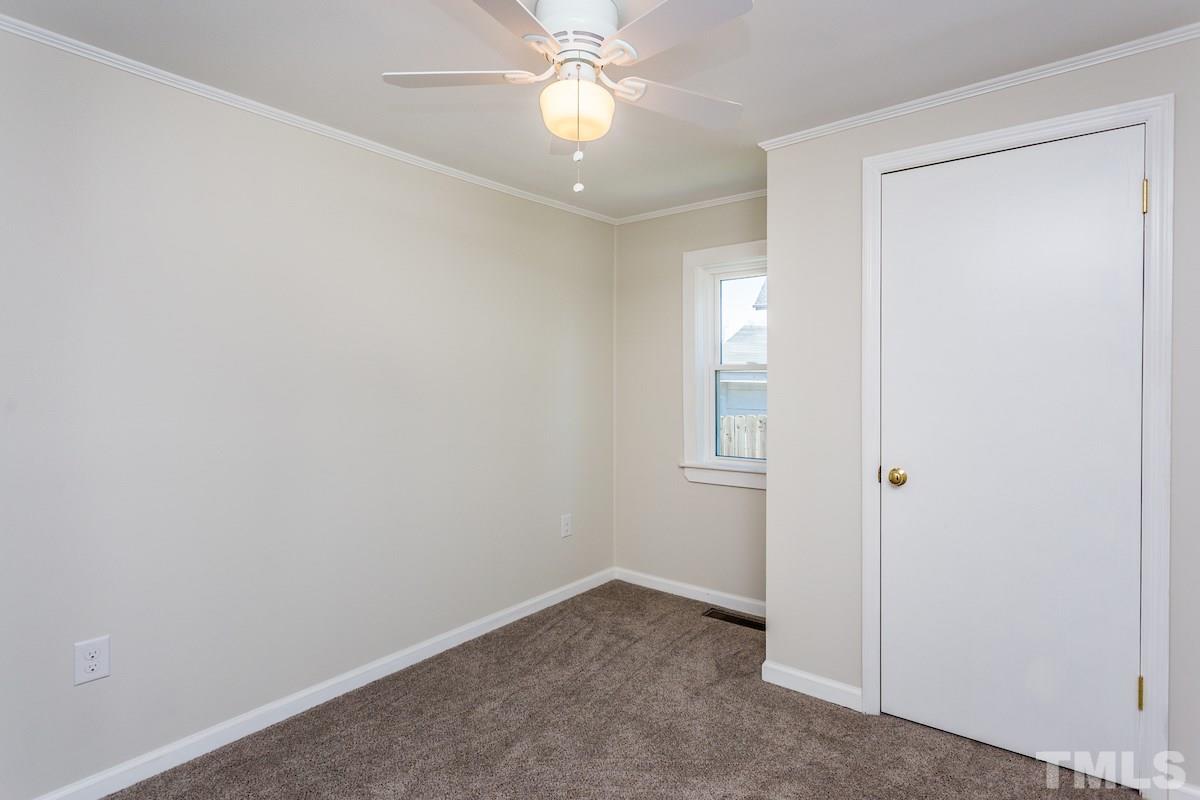 161 Prospect Avenue Raleigh, NC 27603 - Photo 17 of 24 an empty room with closet and a chandelier fan