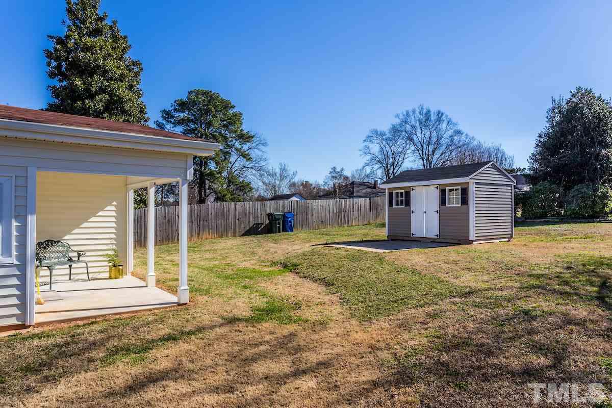 161 Prospect Avenue Raleigh, NC 27603 - Photo 18 of 24 a view of a house with backyard and a tree