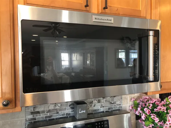 a stove top oven sitting inside of a kitchen