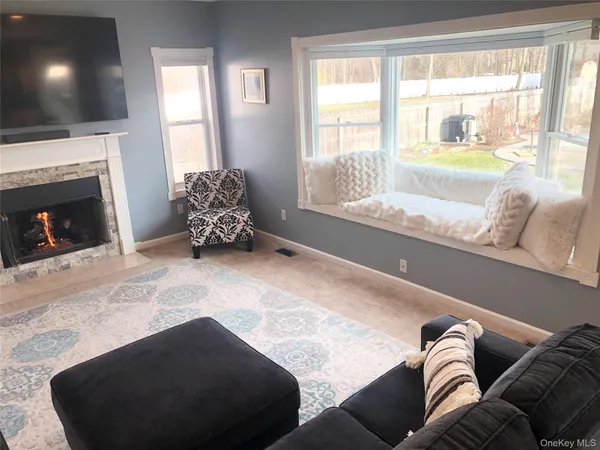 a room with window and bed