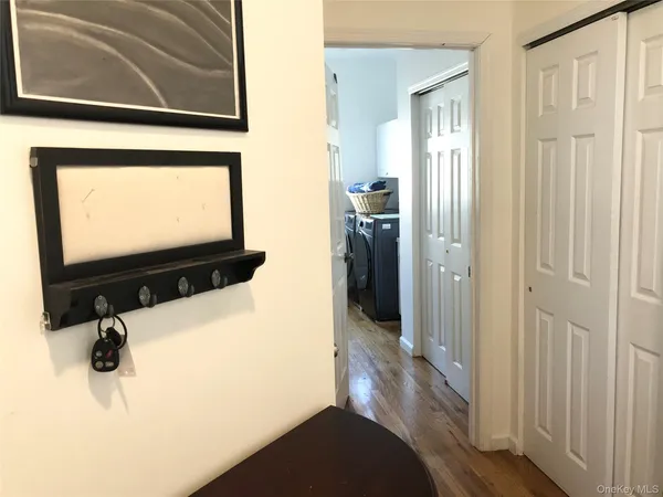 a kitchen with a sink a window and cabinets