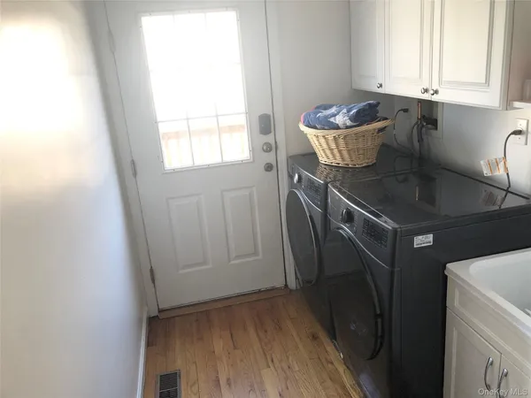 a utility room with dryer and washer