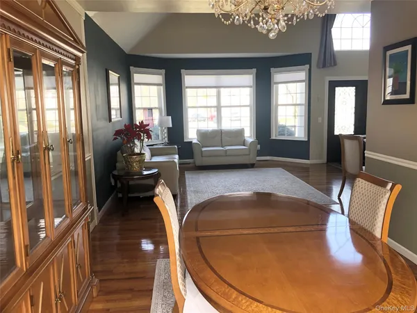 a view of a living room and dining room