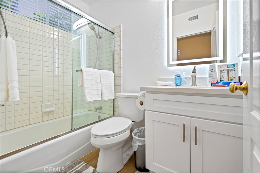 30786 La Mer Laguna Niguel, CA 92677 - Photo 15 of 40 a bathroom with a sink toilet vanity and shower