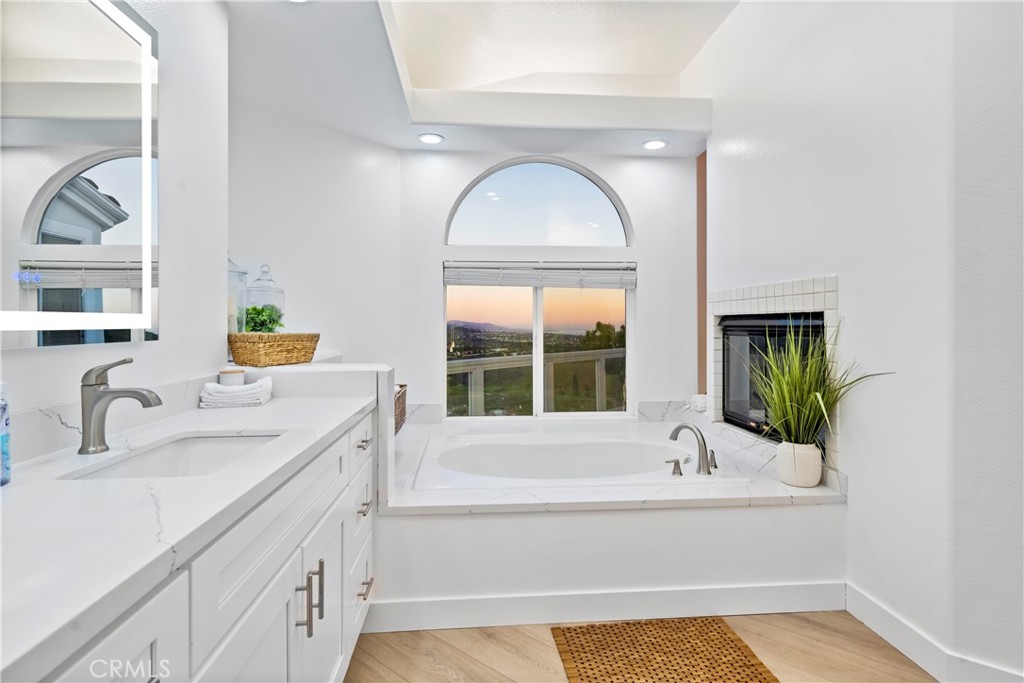 30786 La Mer Laguna Niguel, CA 92677 - Photo 22 of 40 a bathroom with a tub sink and mirror