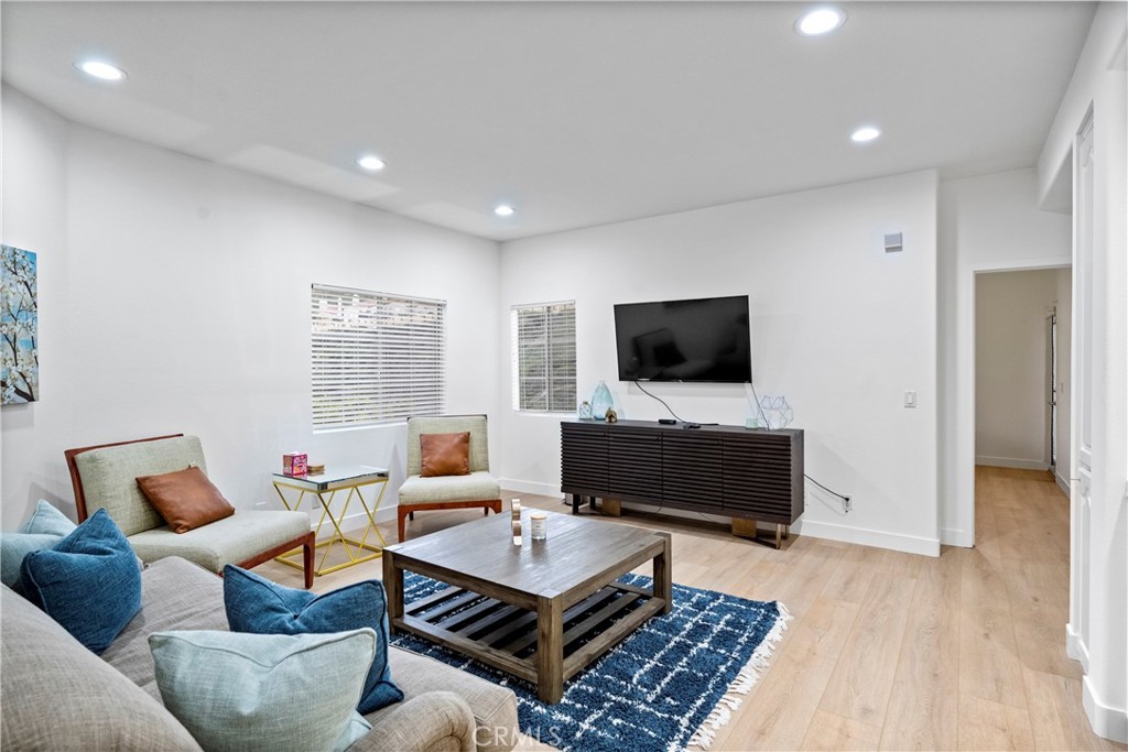 30786 La Mer Laguna Niguel, CA 92677 - Photo 28 of 40 a living room with furniture a flat screen tv and a fireplace
