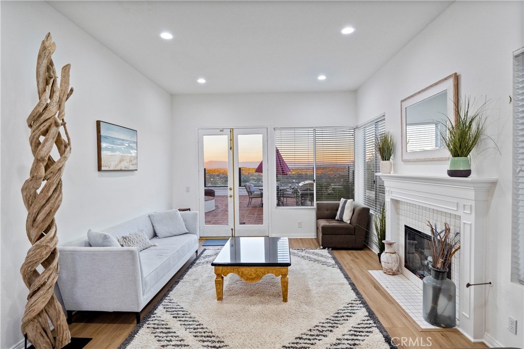 30786 La Mer Laguna Niguel, CA 92677 - Photo 5 of 40 a living room with furniture and a fireplace