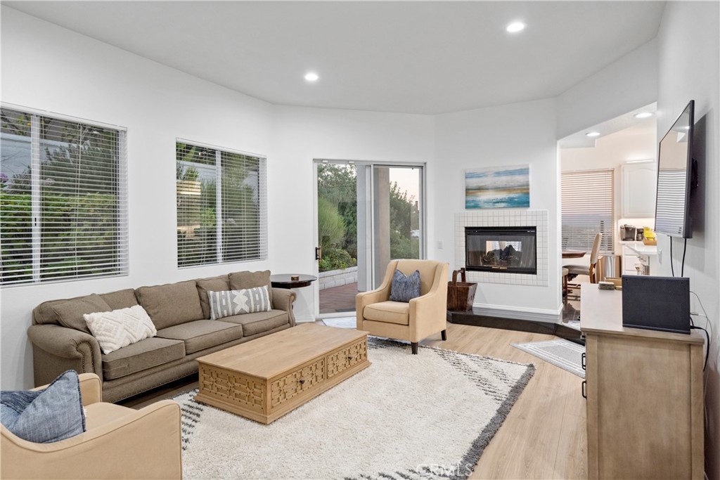 30786 La Mer Laguna Niguel, CA 92677 - Photo 10 of 40 a living room with furniture and a fireplace