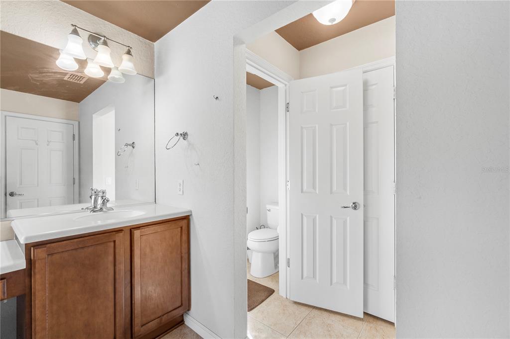 4199 Southwest 46th Court Ocala, FL 34474 - Photo 29 of 50 a bathroom with a double vanity sink and a mirror