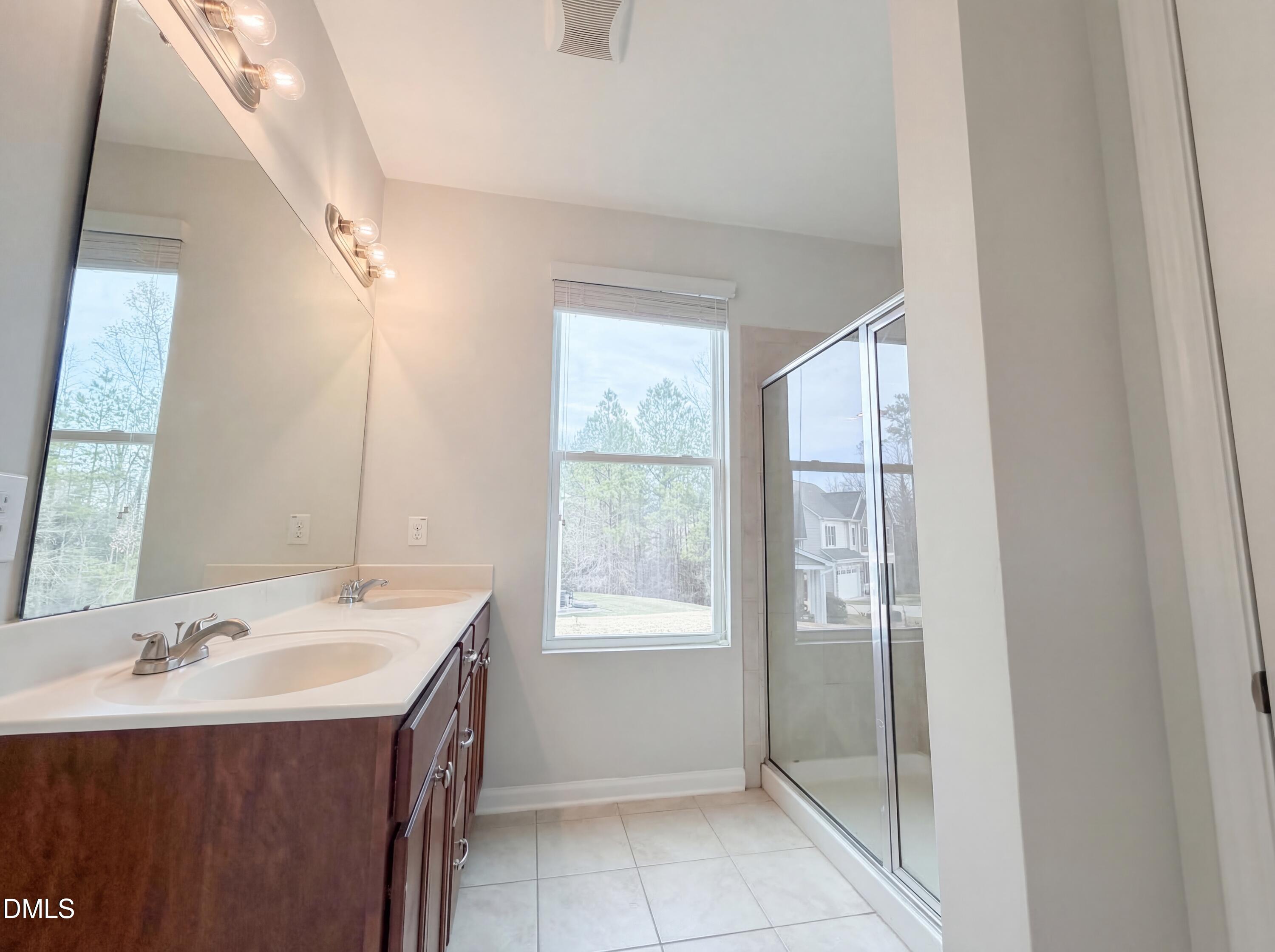 3933 Massey Run Raleigh, NC 27616 - Photo 15 of 19 a bathroom with a sink a vanity and a mirror