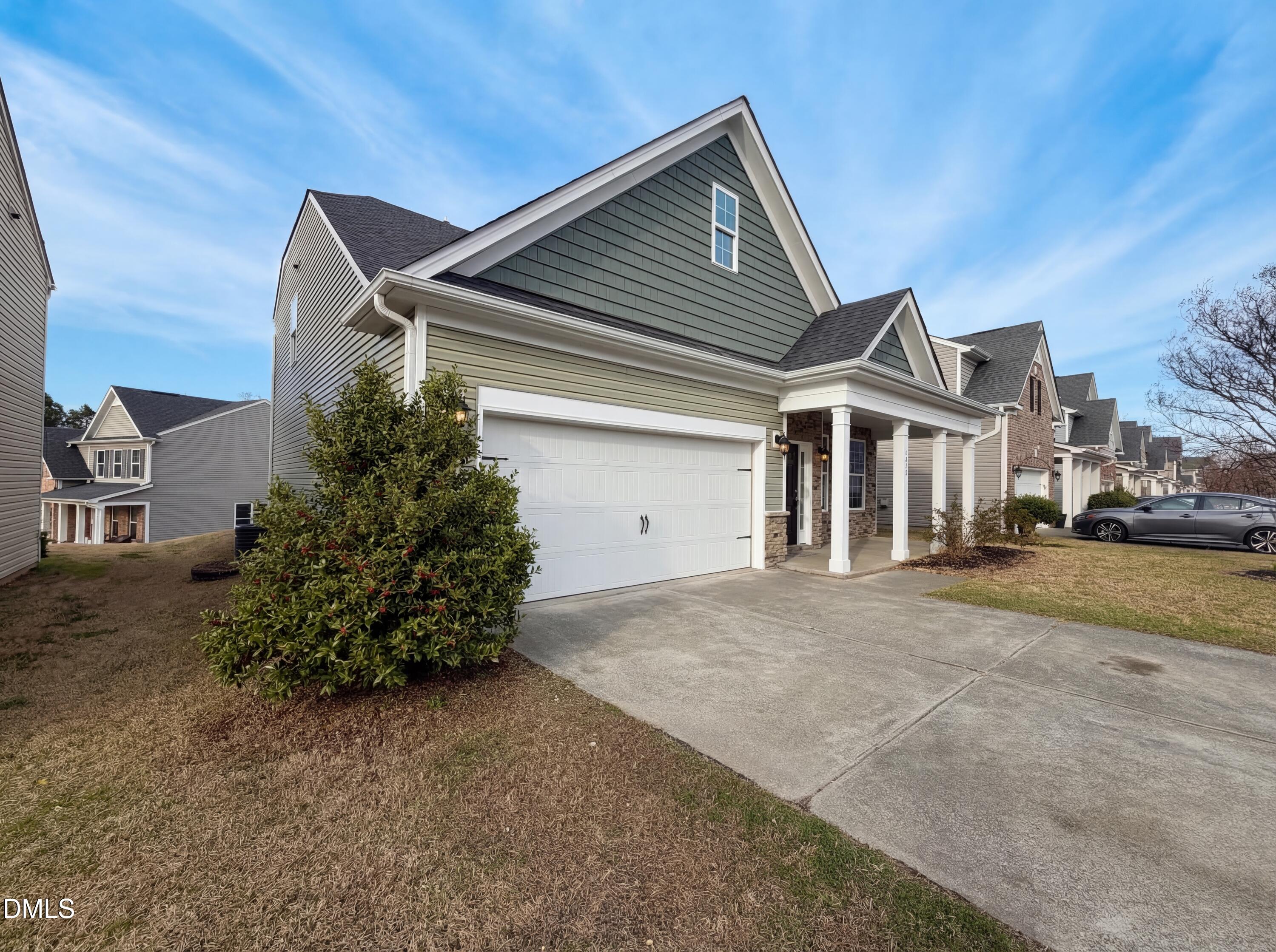 3933 Massey Run Raleigh, NC 27616 - Photo 16 of 19 front view of a house with a street