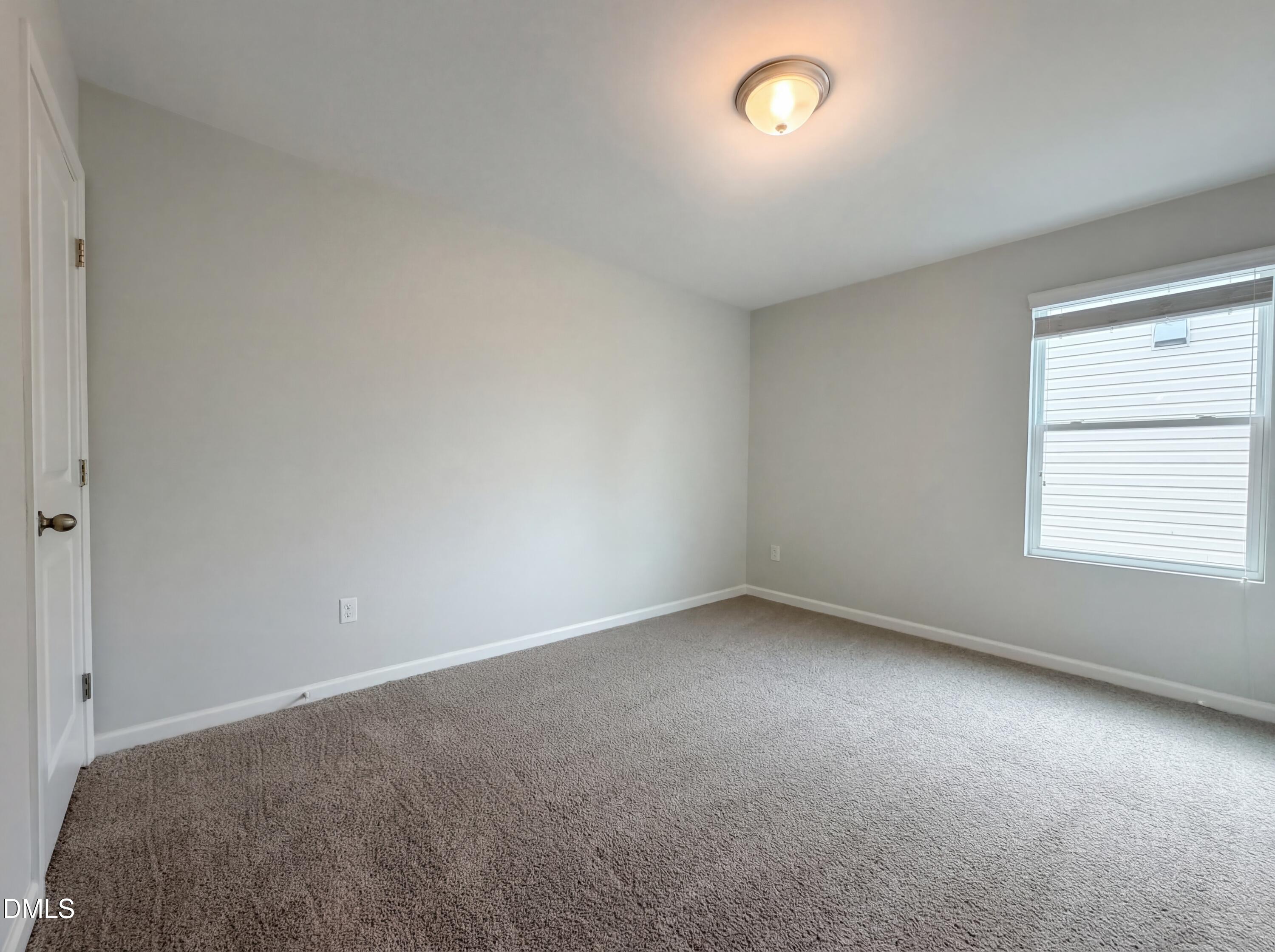 3933 Massey Run Raleigh, NC 27616 - Photo 4 of 19 a view of an empty room with a window