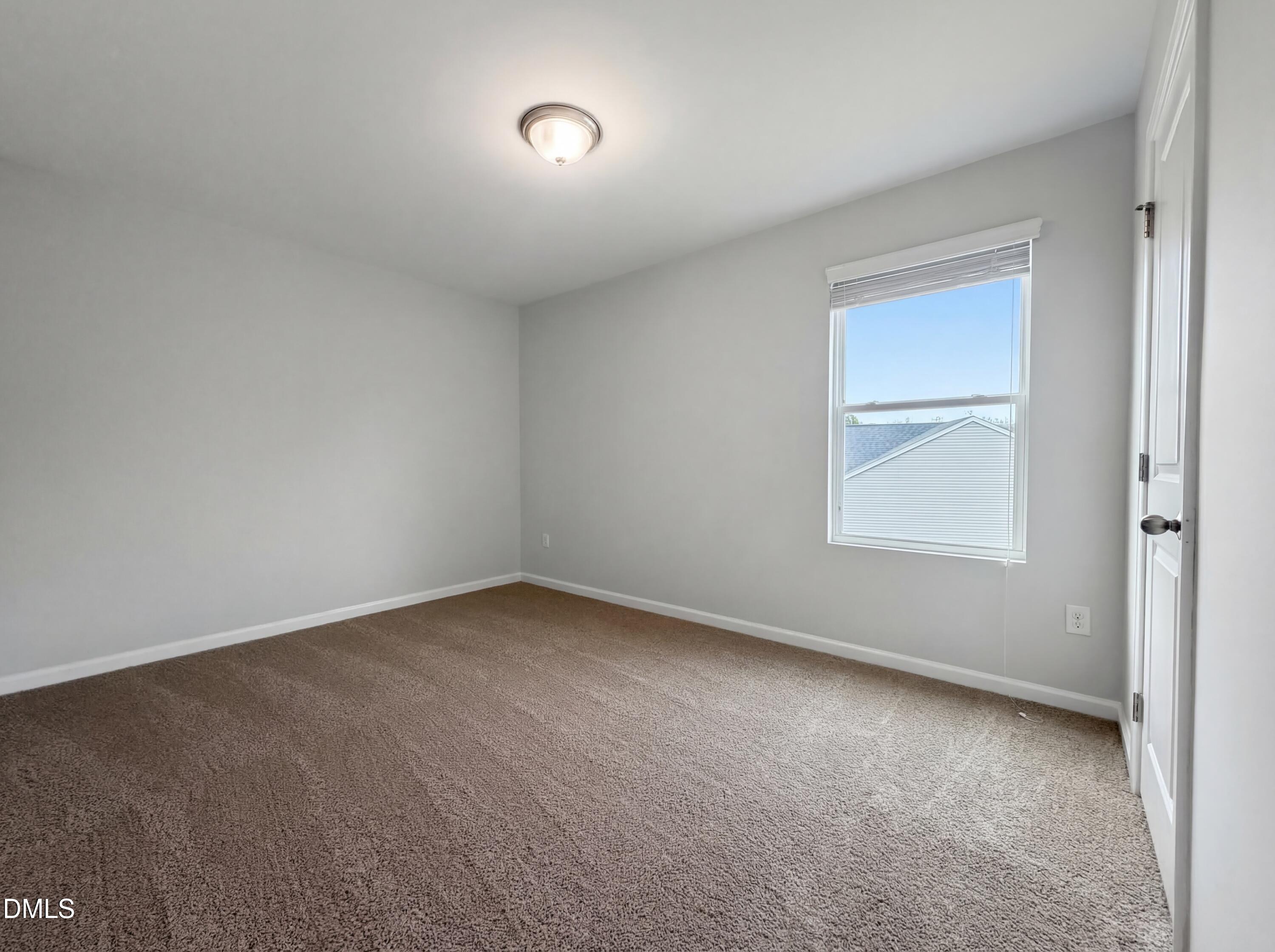 3933 Massey Run Raleigh, NC 27616 - Photo 9 of 19 an empty room with a window