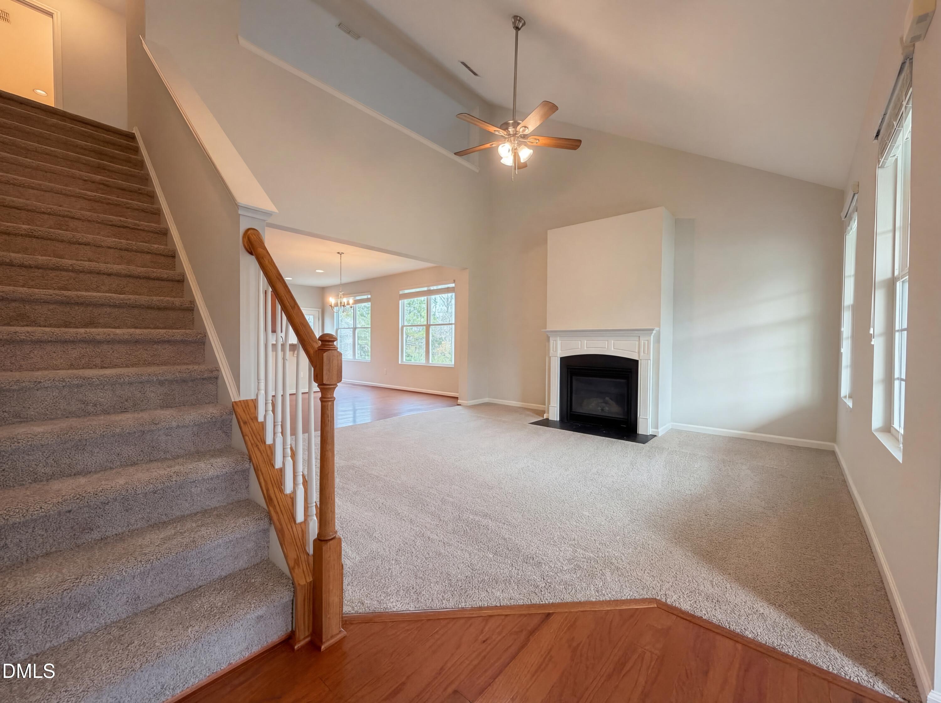 3933 Massey Run Raleigh, NC 27616 - Photo 10 of 19 a view of a livingroom with wooden floor and fireplace
