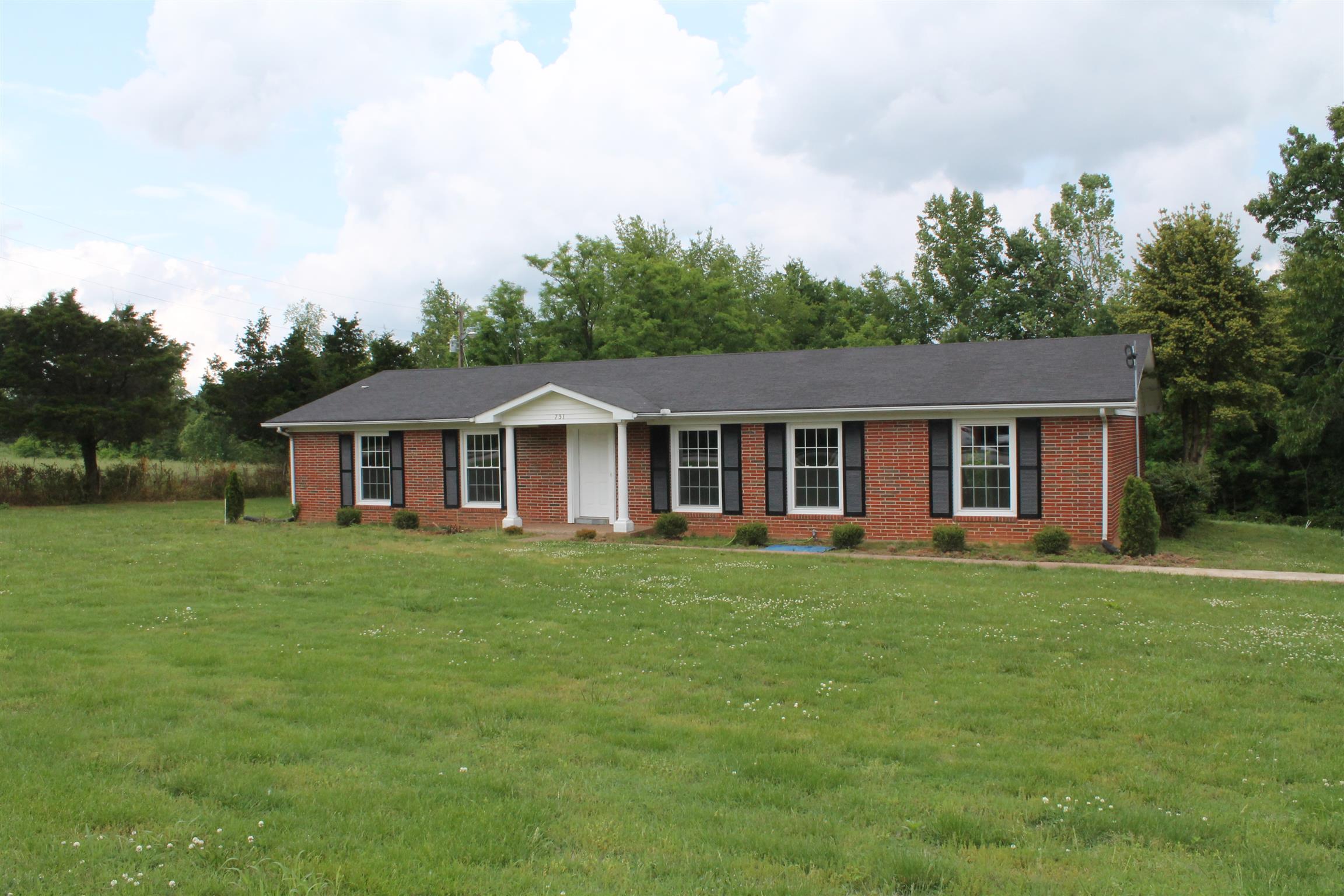 731 Lafayette Road Red Boiling Springs, TN 37150 - Photo 2 of 13 a front of a house with a garden