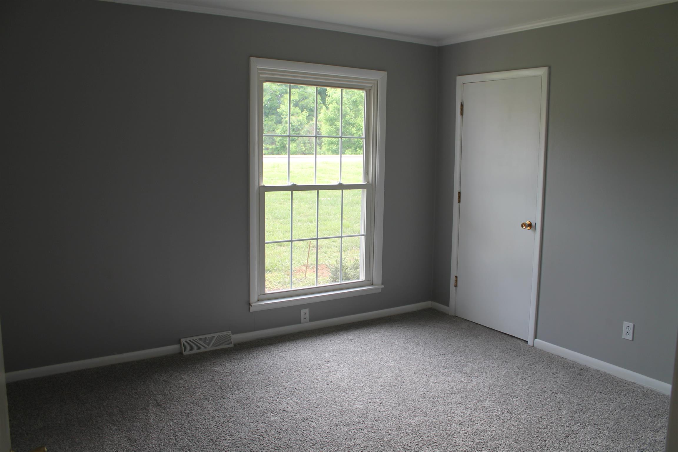 731 Lafayette Road Red Boiling Springs, TN 37150 - Photo 8 of 13 an empty room with a window