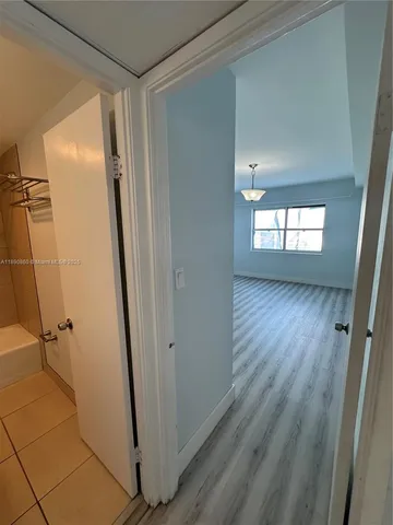 a view of an empty room with a window