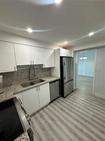 a view of wooden floor in an empty room