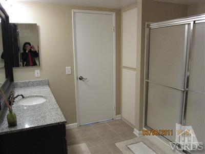 436 Reed Way Port Hueneme, CA 93041 - Photo 16 of 19 a bathroom with a granite countertop sink and a mirror