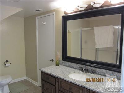436 Reed Way Port Hueneme, CA 93041 - Photo 17 of 19 a bathroom with a granite countertop sink and a mirror
