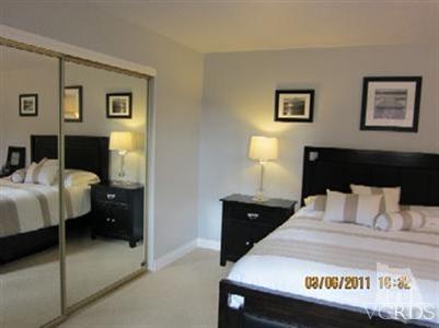 436 Reed Way Port Hueneme, CA 93041 - Photo 9 of 19 a bedroom with a bed and a lamp