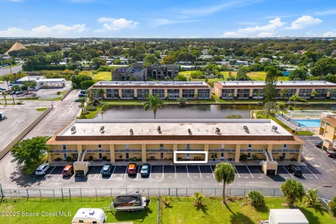 a view of a swimming pool with outdoor seating