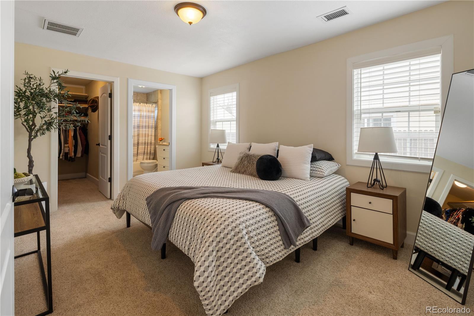 2242 North Lamar Street Edgewater, CO 80214 - Photo 13 of 27 a bedroom with a bed and walk in closet