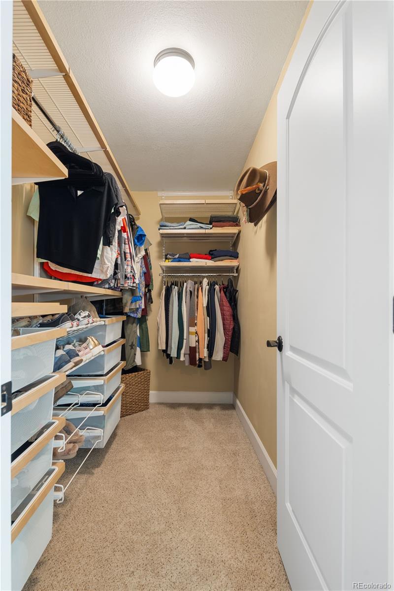 2242 North Lamar Street Edgewater, CO 80214 - Photo 16 of 27 a view of walk in closet with clothes and shoes