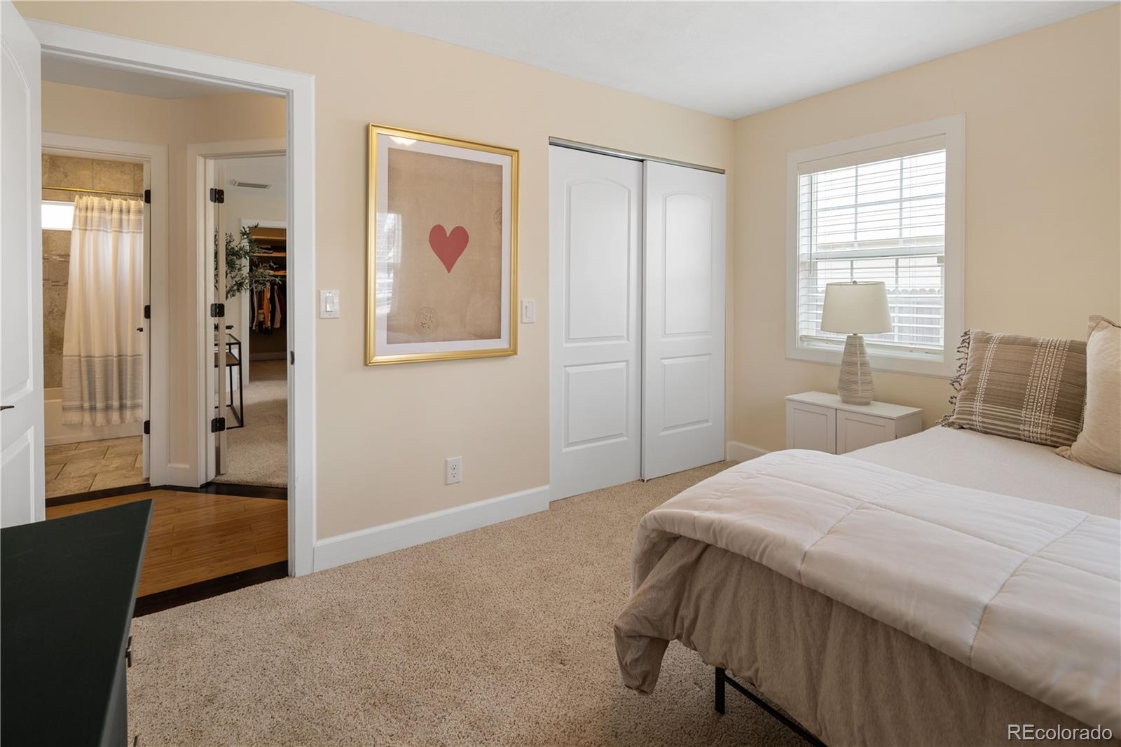 2242 North Lamar Street Edgewater, CO 80214 - Photo 19 of 27 a bedroom with a bed and a window
