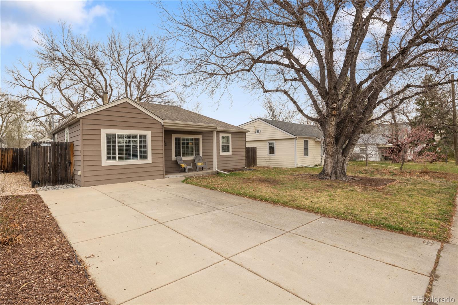 2242 North Lamar Street Edgewater, CO 80214 - Photo 2 of 27 a front view of a house with a garden
