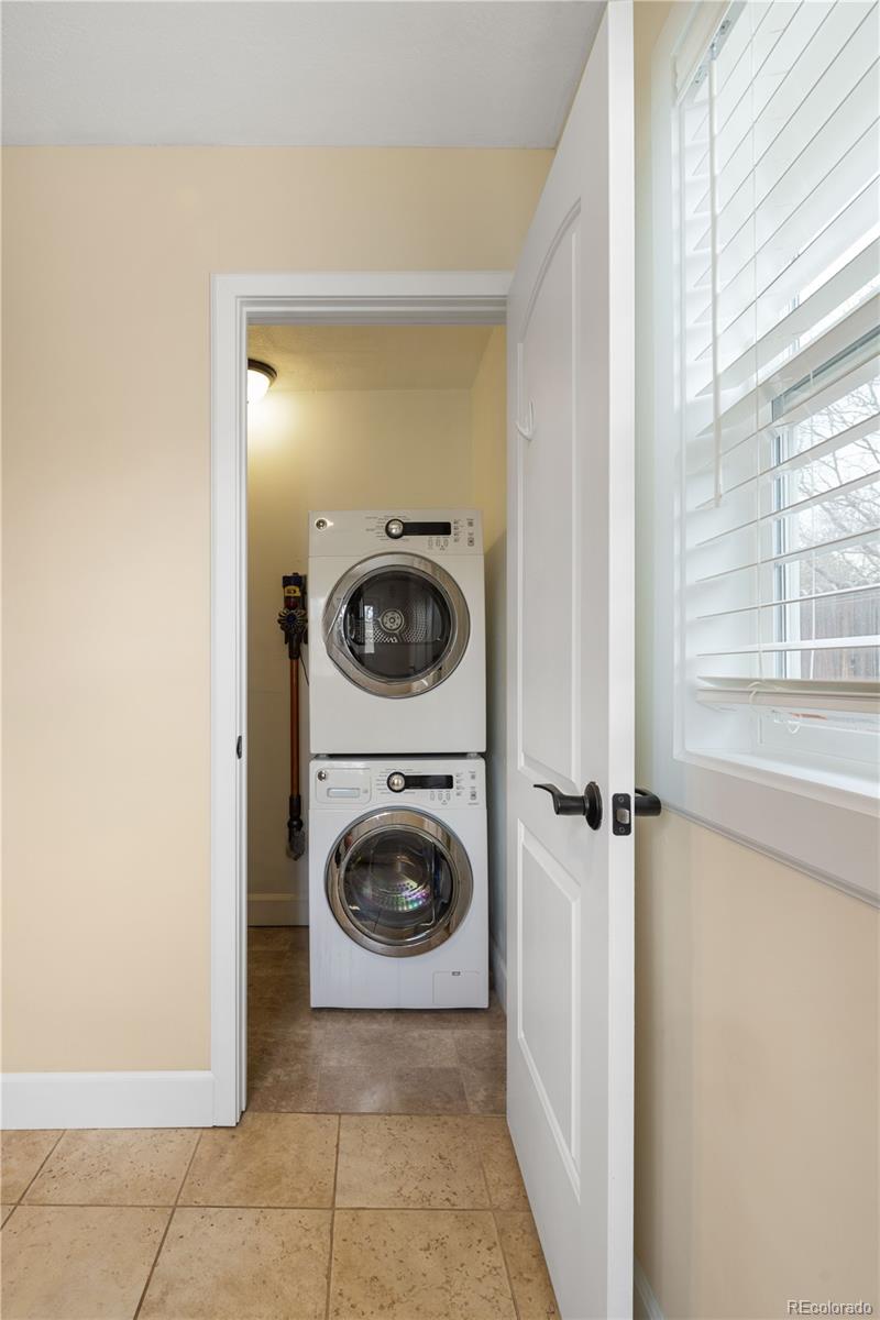 2242 North Lamar Street Edgewater, CO 80214 - Photo 22 of 27 a view of a hallway with washer and dryer