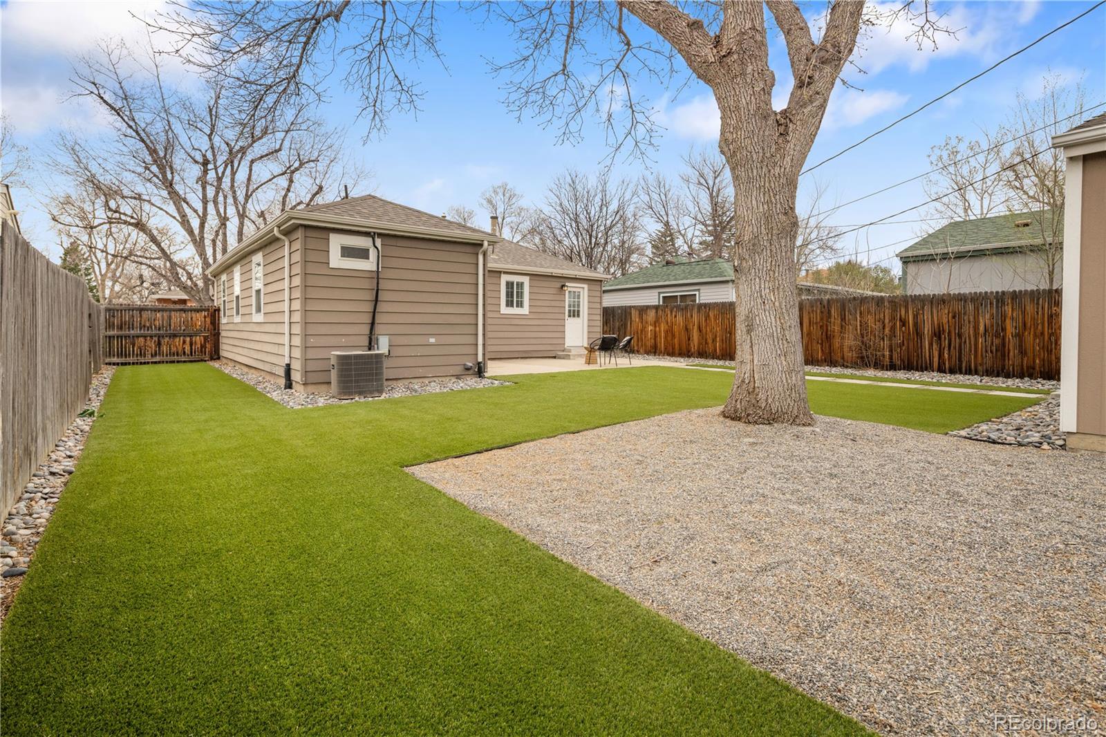 2242 North Lamar Street Edgewater, CO 80214 - Photo 24 of 27 a view of a house with a yard and large tree
